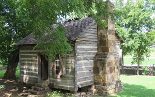 A wooden wattle and daub cabin built in Springdale in the 1850s.