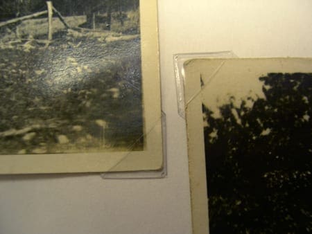 Two photos with clear plastic photo corners on the edges to preserve them well. Photo corners are part of correct care for your photos.