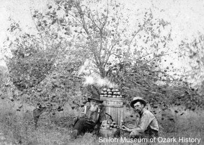 Garrett Williams (left) and Robert Wilson at Williams’ orchard, Buckeye community (Madison County), 1900s.