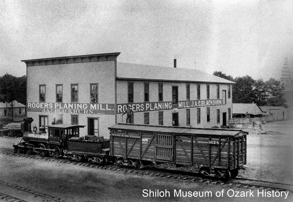 J. A. C. Blackburn’s planing mill and a Frisco Railroad train, Rogers (Benton County, Arkansas), 1890s.