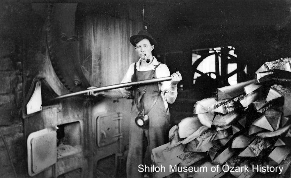 Firing the boiler at the Albright sawmill, Red Star, (Madison County, Arkansas), 1930s. 