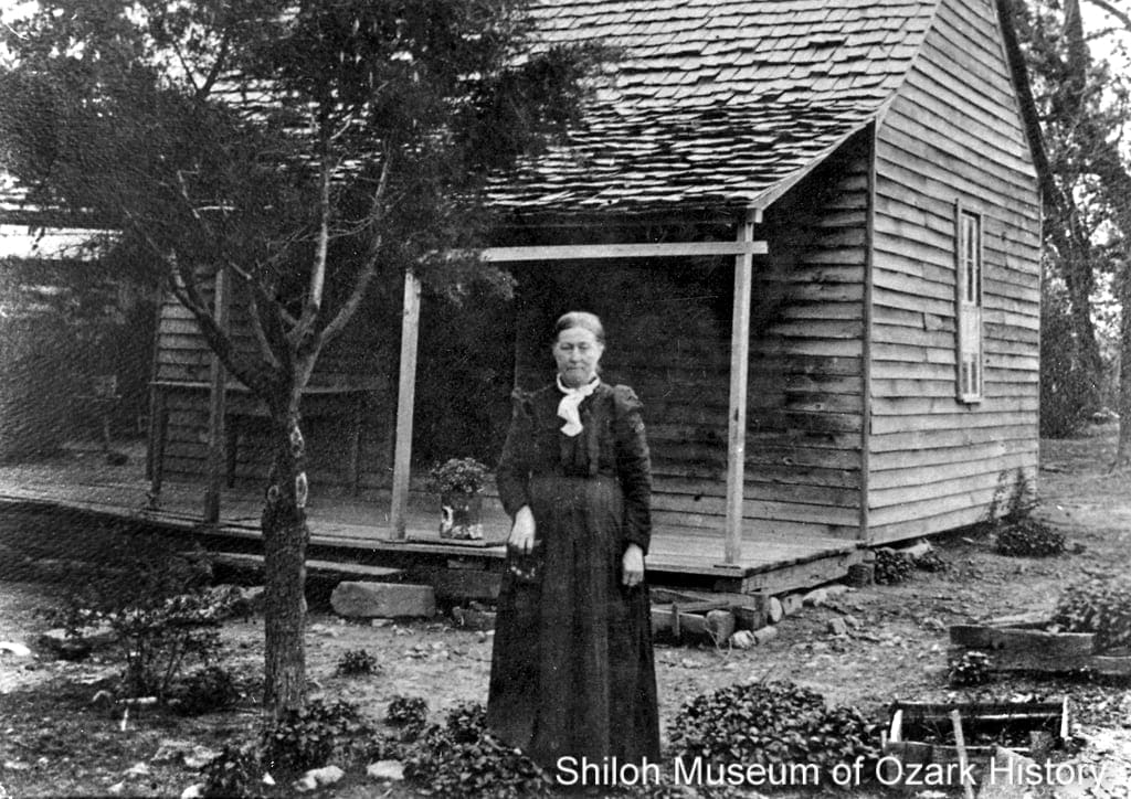 Sarah Harriet Ford Cooper Blaylock in her herb garden, Posey Mountain (near Garfield, Benton County, Arkansas), early 1900s.