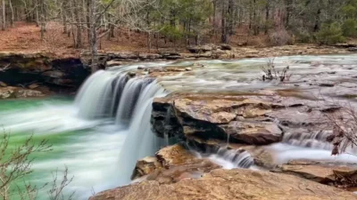 Photo of a small waterfall in a creek or river.