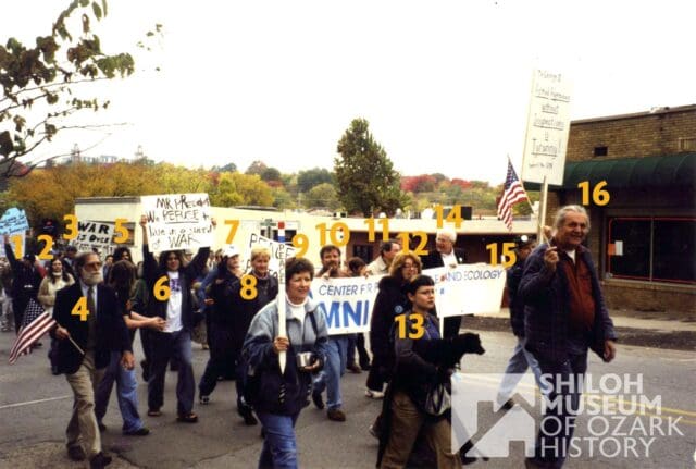It’s #PhotoIDFriday! 📸🚩

Can you help us solve a local history mystery from the early 2000s? We are looking for identifications for this group of anti-war protesters captured on October 26, 2002.

The photo looks to have been taken right on Dickson Street in Fayetteville. While we think we recognize one or two faces in the crowd, we want to make sure we get it right! Can you help us identify the people in this image, or perhaps the exact buildings and storefronts behind them?

If you recognize a face, a place, or remember this day, please let us know in the comments!

📢 Note: If you share this post to your own page, please tag the Shiloh Museum of Ozark History so we can see your responses and save this valuable info for our archives!

Have a safe and wonderful Memorial Day Weekend! ✨

Photo from the Shiloh Museum’s Cyrus Dean Young Collection (S-2003-152-3854).

#ShilohMuseum #FayettevilleAR #DicksonStreet #WashingtonCountyAR