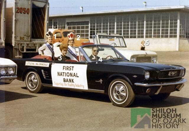 After a brief summer vacation, #PhotoIDFriday returns! πΈβ¨
This is a fun one. Just take a look at that Ford Mustang, the driverβs cool aviator sunglasses, and the crowned children in the back seat who are knighted βLittle Mr. & Mrs. Springdaleβ! ππΆοΈπ
The carβs sign suggests they are with First National Bank in support of the poultry industry. We think this may have been for the Rodeo of the Ozarks parade right here in Springdale. ππ€
Can you help us solve this history mystery? π€ π We know the photo was taken in 1968, but do you recognize any of the people in the car?
And while we're at it, who is the woman just passing through in the background?
If you share this post to your Stories or feed, please make sure your account is public and tag us
@ShilohMuseum so we can see your responses!
Thank you! β€οΈ
π Image Credit: Shiloh Museumβs First National Bank of Springdale Collection (S-2004-97-25).
#ShilohMuseum #SpringdaleArkansas #OzarkHistory #DowntownSpringdale #RodeoOfTheOzarks