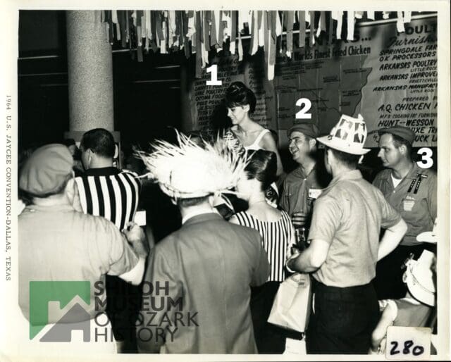 🔍 Calling all History Detectives for #PhotoIDFriday! 📸✨

We need your help identifying the people in this 1964 photo taken at a Jaycees convention in Dallas! Featured here are members of the Arkansas Jaycees posing with "Miss Arkansas Chic."

They could be from Springdale, but we aren't certain. Recognize anyone in this snapshot from the past?

Drop your clues, names, or guesses in the comments below!

(Note: If you share this to your Facebook feed or story, please set the post to public so we can see all the helpful comments!)

Photo is from the Shiloh Museum’s Janice Zulpo Collection (S-2026-20-20).

#PhotoIDFriday #ShilohMuseum #SpringdaleAR #ArkansasJaycees