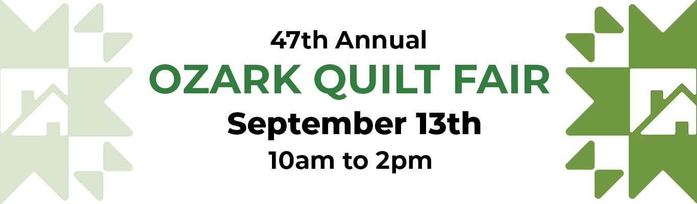 Quilt-Fair-Banner 2025 Quilted pattern in background with quilt star patterns in many colors around the edges. Text in center says 45th Annual Ozark Quilt Fair in orange and green.